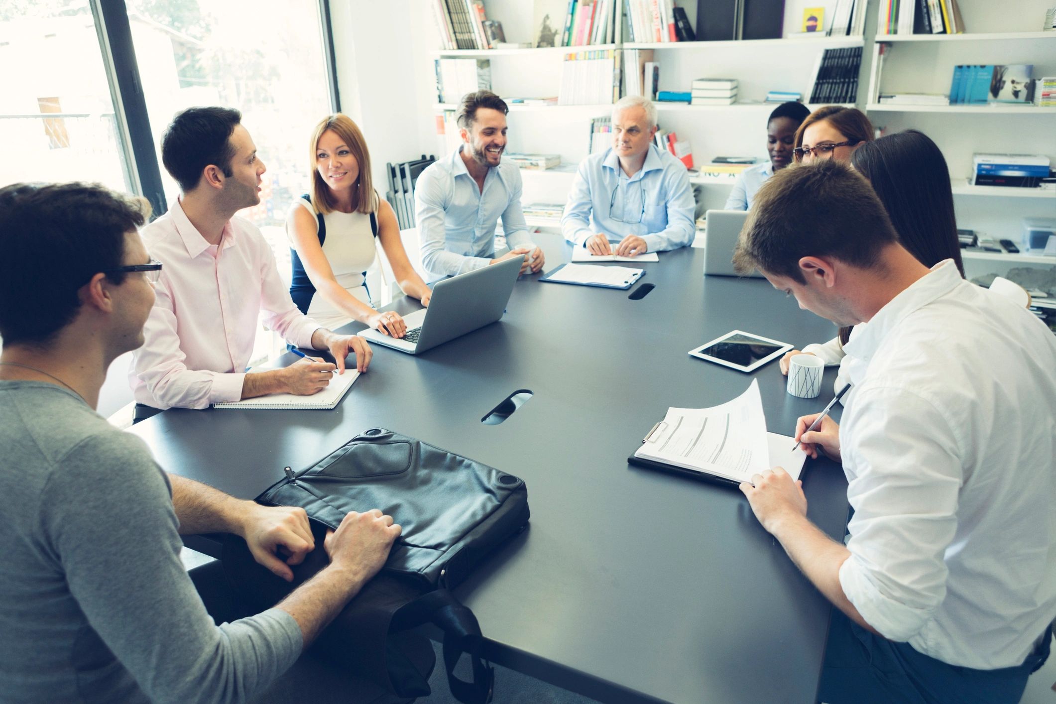 Media team meeting around a conference table